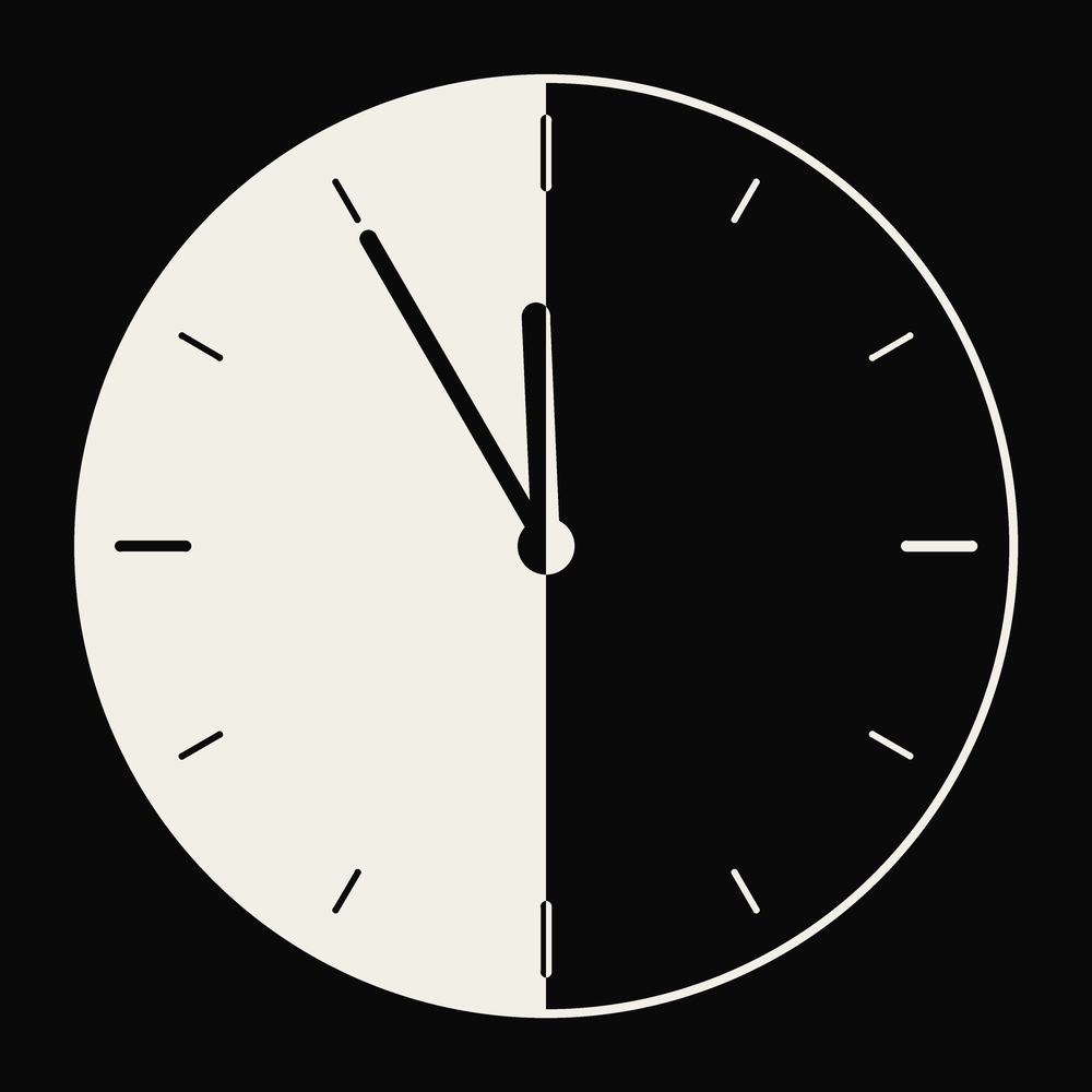 The $LATE mark — a clock at 11:55, left half light, right half dark